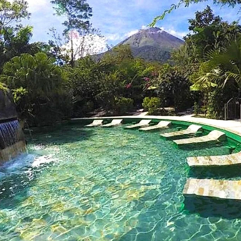 Refreshing swim in the crystal-clear waters of the La Fortuna waterfall.