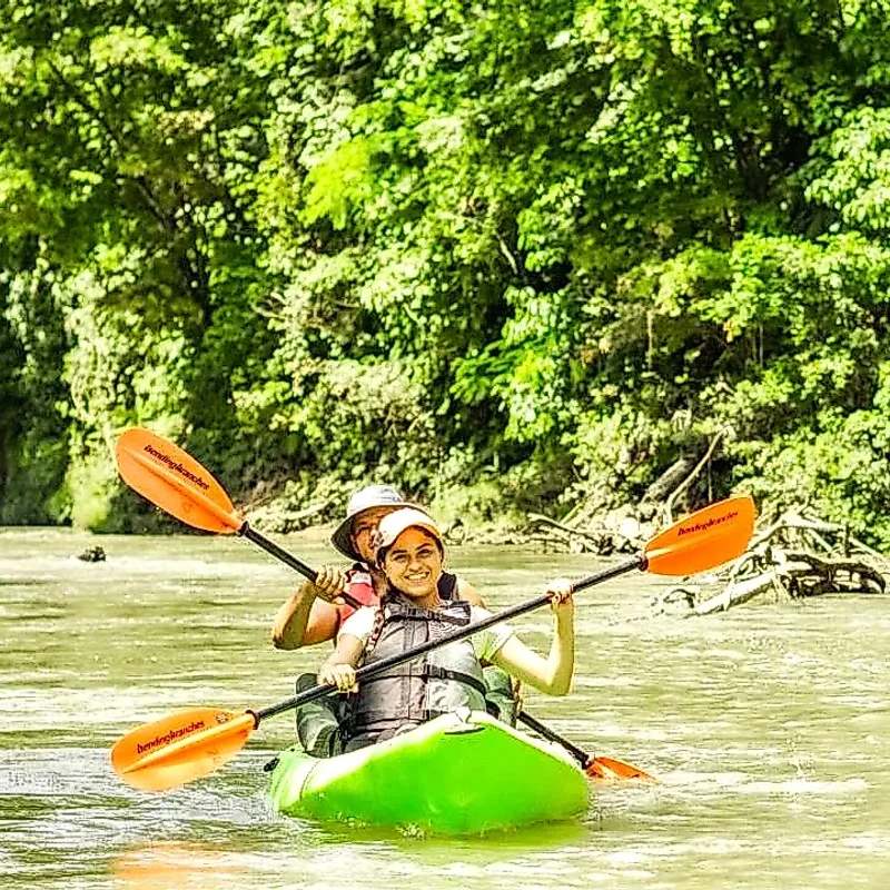 Couple enjoying a kayak tour on the Peñas Blancas River in La Fortuna, Costa Rica.