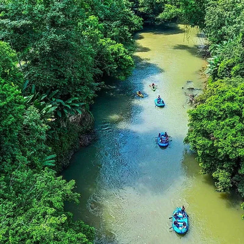 Raft peacefully traveling down the Peñas Blancas River during the Safari Float in La Fortuna.