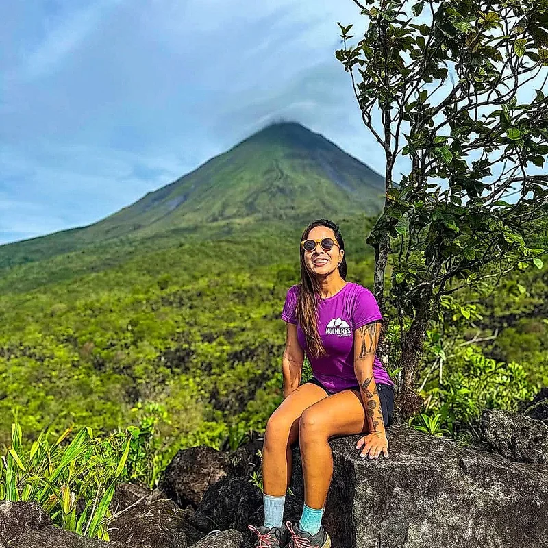 Naturalist guide explaining volcanic history during the trekking tour.